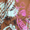 Jupe courte caramel sérigraphiée, coté plissé